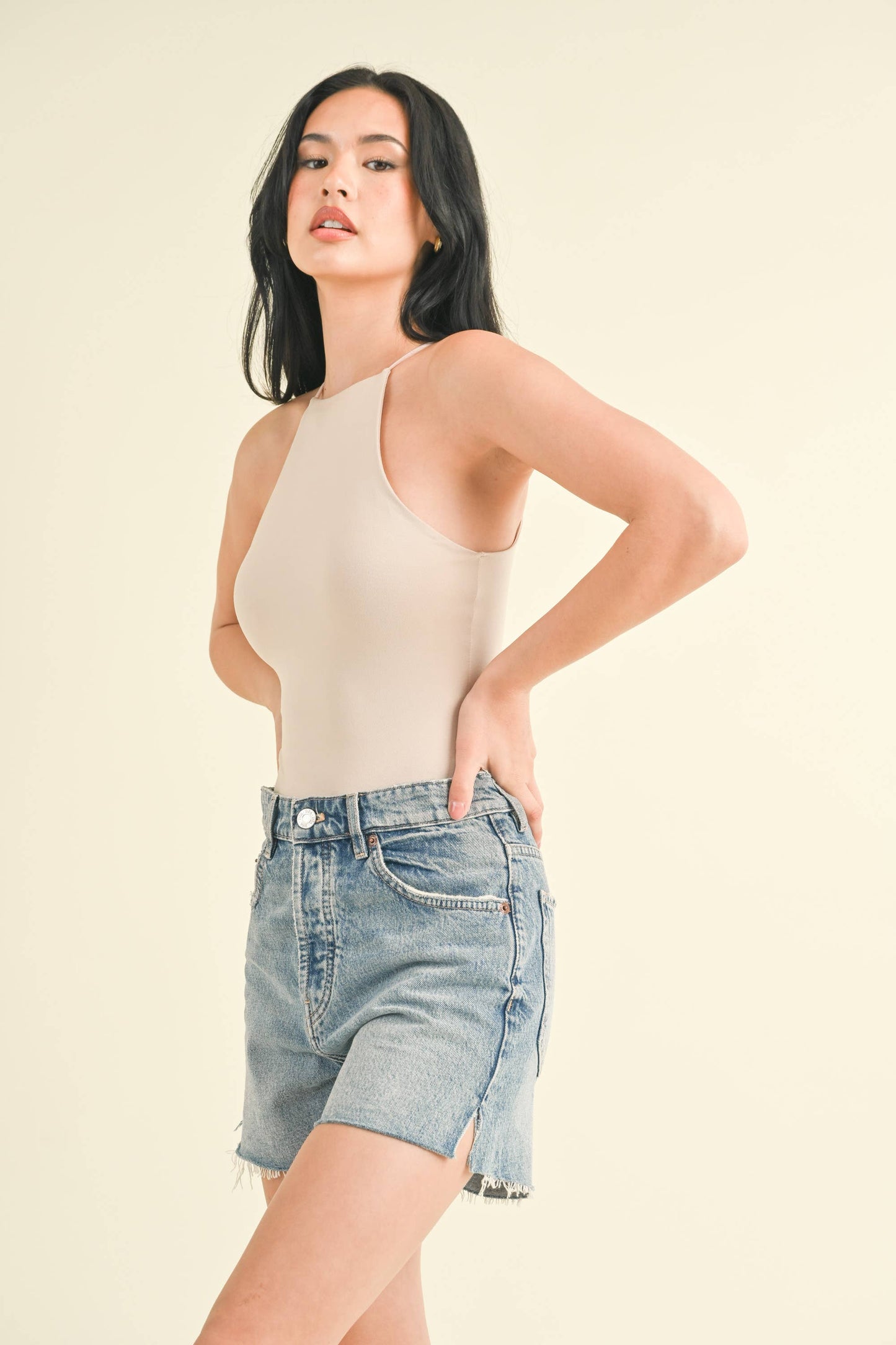 SLEEVELESS HIGH NECK BODYSUIT