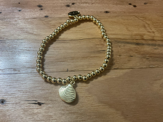 Alex Karol 14 karat gold filled bracelet with a scallop charm