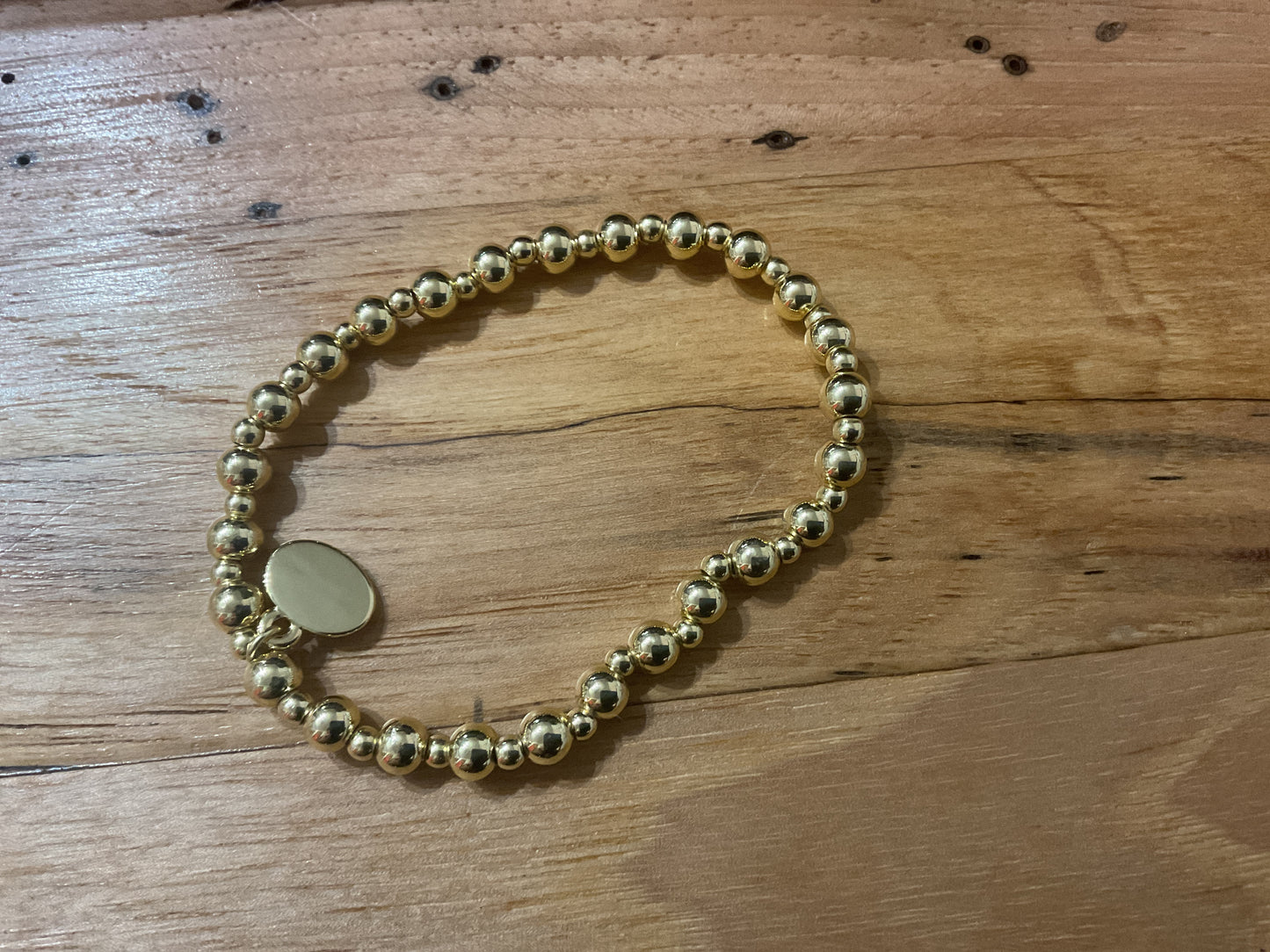 Alex Carol 14 karat gold filled 3 mm and 5 mm graduated gold ball bracelet